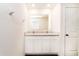 Bathroom with double sink vanity and white cabinets at 6683 Se 3Rd Loop, Ocala, FL 34472