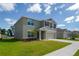 Charming two-story home with a well-manicured lawn and attached two-car garage at 6683 Se 3Rd Loop, Ocala, FL 34472