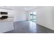 Bright kitchen area with stainless steel appliances and sliding glass door to backyard at 6683 Se 3Rd Loop, Ocala, FL 34472