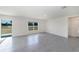 Open-concept living room with tile flooring and sliding glass door to the yard at 6683 Se 3Rd Loop, Ocala, FL 34472