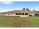 Expansive backyard featuring a well-maintained lawn, perfect for outdoor activities and relaxation at 10458 Sw 52Nd Ct, Ocala, FL 34476