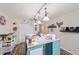 Another angle of the craft room shows a large table and wood flooring at 10458 Sw 52Nd Ct, Ocala, FL 34476