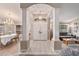 Elegant foyer with tiled floors, decorative columns, high ceilings, chandelier, and an open floor plan at 10458 Sw 52Nd Ct, Ocala, FL 34476