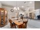 Breakfast nook with wood table and chairs is situated between kitchen and butler's pantry at 10458 Sw 52Nd Ct, Ocala, FL 34476