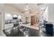 Bright kitchen with stainless steel appliances, black countertops, and a large island at 10458 Sw 52Nd Ct, Ocala, FL 34476