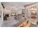 Spacious living room featuring a fireplace, sliding glass doors, and seamless flow into the dining area at 10458 Sw 52Nd Ct, Ocala, FL 34476