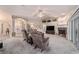 Spacious living room with fireplace, vaulted ceiling, large windows, and plush carpeting at 10458 Sw 52Nd Ct, Ocala, FL 34476