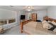 Spacious bedroom with a ceiling fan and window with exterior views at 10458 Sw 52Nd Ct, Ocala, FL 34476