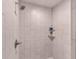 Shower showcasing new tile, modern fixtures, and a convenient built-in shelf at 10458 Sw 52Nd Ct, Ocala, FL 34476