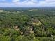 Lush, green canopy surrounds a home nestled on a serene and expansive plot of land at 18341 Nw 142Nd Court Rd, Williston, FL 32696