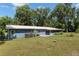 Home exterior view of the back of the house with screened in porch and patio at 18341 Nw 142Nd Court Rd, Williston, FL 32696