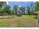 Spacious, well-maintained backyard featuring a storage shed and landscaping at 18341 Nw 142Nd Court Rd, Williston, FL 32696