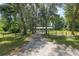 Charming home with a long driveway and beautiful, mature trees offering a sense of privacy and seclusion at 18341 Nw 142Nd Court Rd, Williston, FL 32696