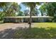 Charming front porch with white railings and a welcoming entrance to the home at 18341 Nw 142Nd Court Rd, Williston, FL 32696