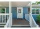 Inviting front porch features a charming welcome mat and classic design elements at 18341 Nw 142Nd Court Rd, Williston, FL 32696