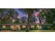 Charming single-story home with a welcoming porch and lush landscaping at 18341 Nw 142Nd Court Rd, Williston, FL 32696