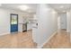 Bright kitchen featuring stainless steel appliances, granite countertops, and a pop of color from the blue door at 18341 Nw 142Nd Court Rd, Williston, FL 32696