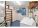 Functional laundry room equipped with a washer, dryer, and ample shelving for storage solutions at 18341 Nw 142Nd Court Rd, Williston, FL 32696
