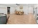 Spacious living room featuring light wood floors, neutral paint, and ample natural light at 18341 Nw 142Nd Court Rd, Williston, FL 32696