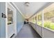 Long, screened in porch perfect for entertaining or relaxing at 18341 Nw 142Nd Court Rd, Williston, FL 32696