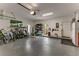 Spacious garage featuring ample storage space, a utility sink, and an exterior door at 1882 Royal Lytham Ct, Port Orange, FL 32128