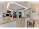 Bright kitchen featuring granite countertops, modern appliances, and plenty of cabinet space for storage at 1882 Royal Lytham Ct, Port Orange, FL 32128