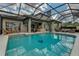 Enjoy the outdoors with this large screened-in pool and beautiful outdoor seating and bar area at 1882 Royal Lytham Ct, Port Orange, FL 32128