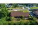 Aerial view showcasing the home's roof, landscaping, and neighborhood surroundings at 2030 Se 32Nd Ln, Ocala, FL 34471