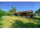 Inviting backyard featuring a covered patio area and landscaped yard, perfect for enjoying the outdoors at 2030 Se 32Nd Ln, Ocala, FL 34471