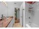Bright bathroom featuring a stylish glass bowl sink, updated fixtures, and a tiled shower/tub at 2030 Se 32Nd Ln, Ocala, FL 34471