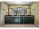 Stylish bathroom featuring dual vessel sinks, marble countertops, and modern fixtures for a spa-like experience at 2030 Se 32Nd Ln, Ocala, FL 34471