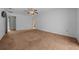 Comfortable bedroom with neutral walls, plush carpeting, and a ceiling fan for added comfort at 2030 Se 32Nd Ln, Ocala, FL 34471