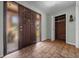 Inviting foyer with a stylish front door, tiled flooring, and convenient access to the coat closet at 2030 Se 32Nd Ln, Ocala, FL 34471