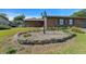 Manicured front yard with lovely rock garden and a lamp post enhance the curb appeal of this brick house at 2030 Se 32Nd Ln, Ocala, FL 34471