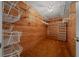 Spacious walk-in closet with custom wood paneling and organized wire shelving for ample storage at 2030 Se 32Nd Ln, Ocala, FL 34471