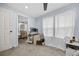 Bedroom featuring a ceiling fan, a neutral color scheme, and abundant natural light at 21776 Nw 57Th Ave, Micanopy, FL 32667