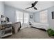 Bedroom featuring a ceiling fan, a neutral color scheme, and abundant natural light at 21776 Nw 57Th Ave, Micanopy, FL 32667