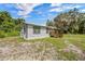 A charming single-story home in a serene setting, complemented by mature trees and a well-maintained yard at 21776 Nw 57Th Ave, Micanopy, FL 32667