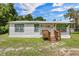Charming single story home featuring a new metal roof, freshly painted siding and a cozy front porch at 21776 Nw 57Th Ave, Micanopy, FL 32667