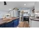 Well-lit kitchen featuring an island with wood countertop, stainless steel appliances, and white cabinetry at 21776 Nw 57Th Ave, Micanopy, FL 32667