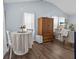 Inviting living room with wood flooring, comfortable seating, and bright natural light creating a cozy atmosphere at 21776 Nw 57Th Ave, Micanopy, FL 32667