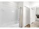 Bright bathroom features a shower/tub combo with white tile and modern fixtures at 2950 Lucayan Harbour Cir # 107, Kissimmee, FL 34746