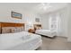 Bright bedroom features two beds, each with wood headboards and matching side tables at 2950 Lucayan Harbour Cir # 107, Kissimmee, FL 34746