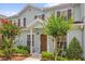 Townhome with well-kept landscaping and light blue siding at 2950 Lucayan Harbour Cir # 107, Kissimmee, FL 34746