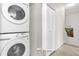A laundry area with stacked washer and dryer at 2950 Lucayan Harbour Cir # 107, Kissimmee, FL 34746