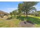 Serene backyard with mature trees and manicured lawn, creating a private and peaceful outdoor space at 7274 Sw 95Th Ave, Ocala, FL 34481