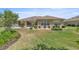 Well-manicured backyard with landscaping and patio area for relaxation at 7274 Sw 95Th Ave, Ocala, FL 34481