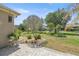 Well-manicured backyard featuring lush landscaping and a paver patio, perfect for outdoor entertaining at 7274 Sw 95Th Ave, Ocala, FL 34481