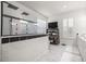 Modern bathroom featuring a sleek glass shower, white cabinets, and a window at 7274 Sw 95Th Ave, Ocala, FL 34481