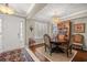 Well-lit dining room featuring a chandelier, hardwood floors, and a decorative hutch at 7274 Sw 95Th Ave, Ocala, FL 34481